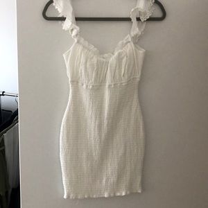 White mini dress with ruffle sleeve